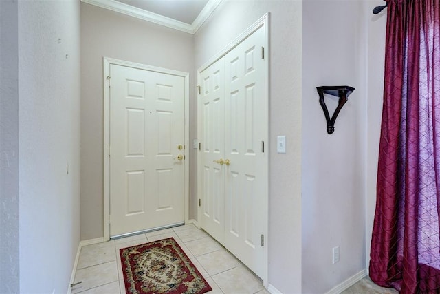 4408 32nd Pl, Oklahoma City, OK 73112 - entryway with crown molding, light tile patterned floors, and baseboards