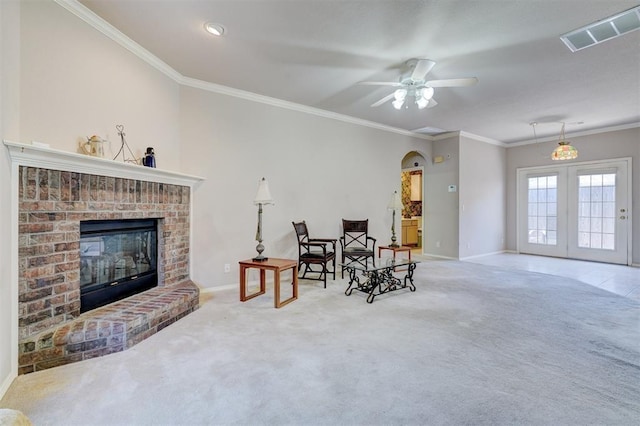 4408 32nd Pl, Oklahoma City, OK 73112 - living area featuring baseboards, ornamental molding, carpet floors, a brick fireplace, and visible vents