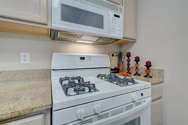 4408 32nd Pl, Oklahoma City, OK 73112 - kitchen featuring light countertops, white appliances, and a textured wall