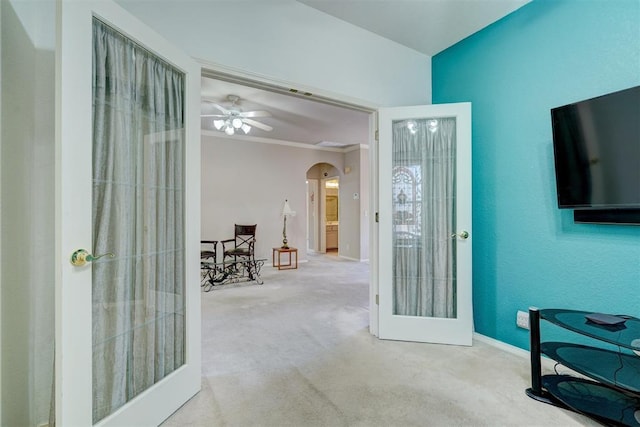 4408 32nd Pl, Oklahoma City, OK 73112 - interior space with french doors, crown molding, a ceiling fan, arched walkways, and carpet