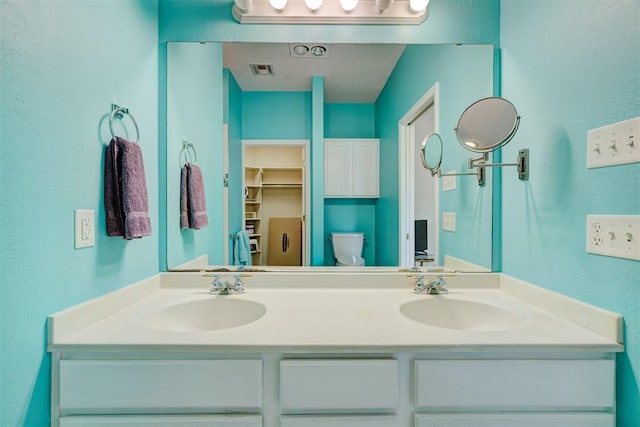 4408 32nd Pl, Oklahoma City, OK 73112 - full bathroom with double vanity, a sink, and visible vents