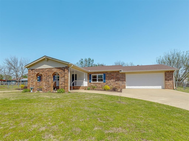 ranch-style house with a porch, a front lawn, brick siding, a garage, and driveway