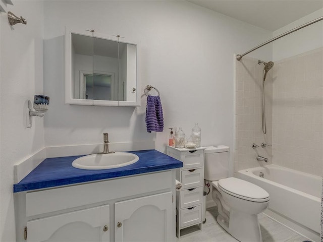 bathroom with toilet, vanity, and shower / washtub combination