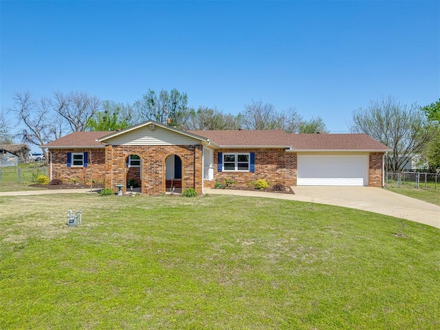 single story home with a garage, fence, concrete driveway, brick siding, and a front lawn