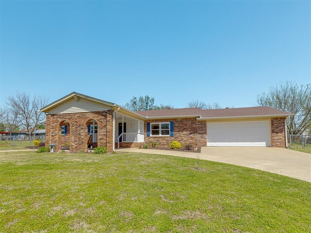 721 Ladd Ave, Depew, OK 74028 - single story home with brick siding, a garage, driveway, and covered porch