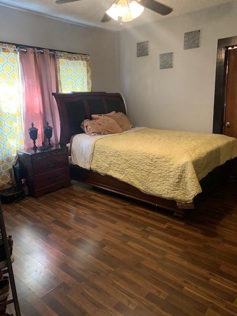 4115 S Shields Blvd, Oklahoma City, OK 73129 - bedroom featuring ceiling fan and wood finished floors