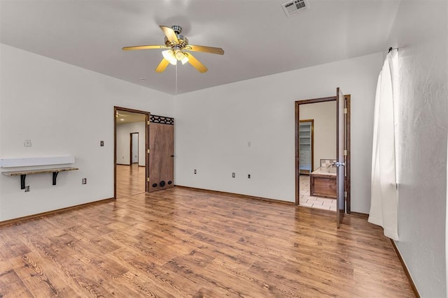 unfurnished living room featuring visible vents, baseboards, light wood-style flooring, and ceiling fan