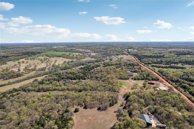 drone / aerial view featuring a forest view