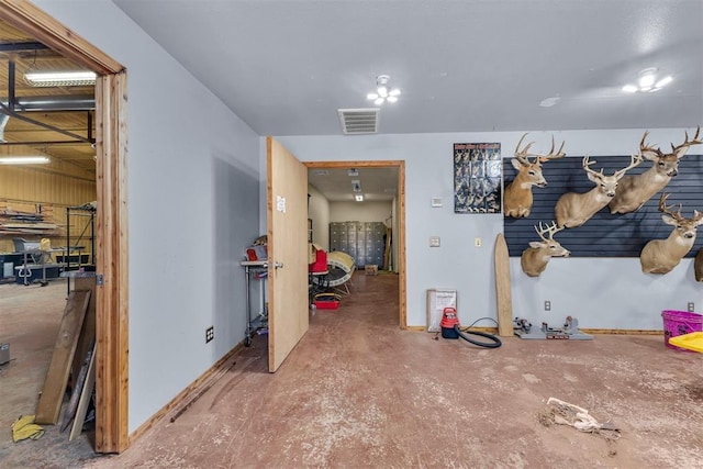 interior space with concrete flooring and visible vents