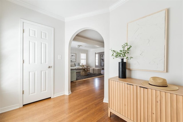 905 NW 40th St, Oklahoma City, OK 73118 - hallway with baseboards, arched walkways, light wood-type flooring, and ornamental molding