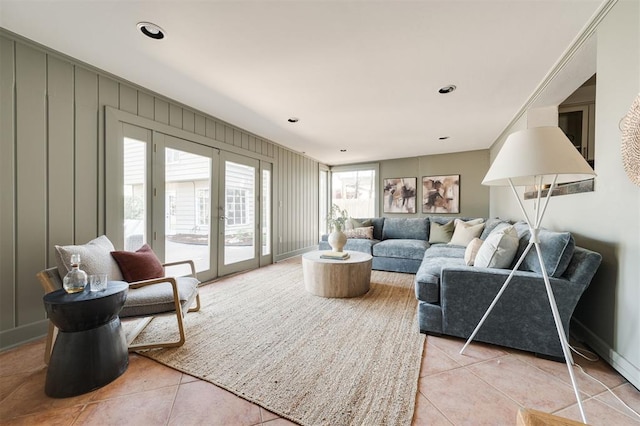 905 NW 40th St, Oklahoma City, OK 73118 - living room featuring light tile patterned floors and french doors