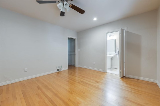 905 NW 40th St, Oklahoma City, OK 73118 - unfurnished bedroom featuring baseboards, recessed lighting, ensuite bath, visible vents, and light wood finished floors