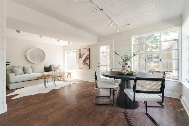 905 NW 40th St, Oklahoma City, OK 73118 - dining room featuring dark wood-type flooring, baseboards, and track lighting