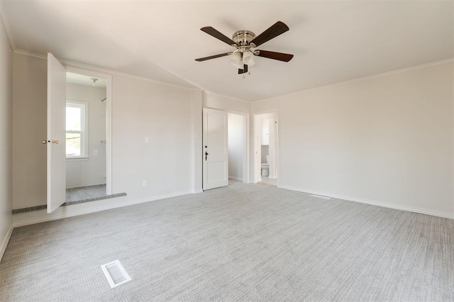 905 NW 40th St, Oklahoma City, OK 73118 - carpeted spare room featuring ornamental molding, visible vents, baseboards, and a ceiling fan