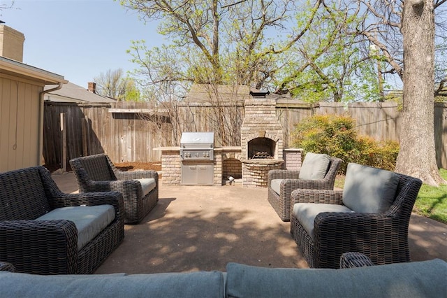 905 NW 40th St, Oklahoma City, OK 73118 - view of patio with grilling area, an outdoor brick fireplace, and a fenced backyard