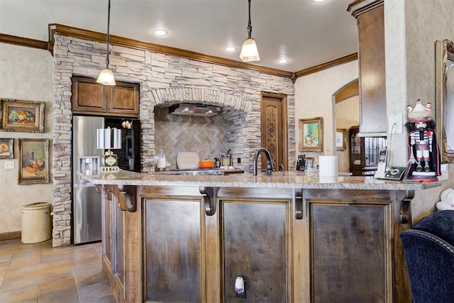 2293 Cottage Ln, Blanchard, OK 73010 - bar area featuring crown molding, stainless steel refrigerator with ice dispenser, decorative light fixtures, light stone finish flooring, and recessed lighting