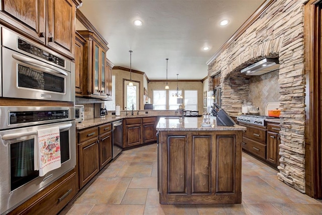 2293 Cottage Ln, Blanchard, OK 73010 - kitchen with wall chimney range hood, stainless steel appliances, stone tile flooring, a peninsula, and ornamental molding