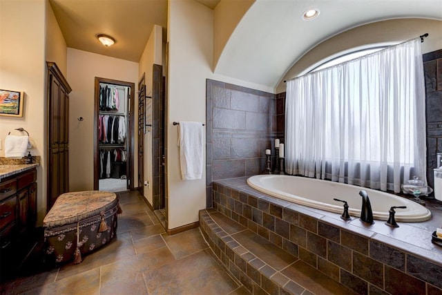 2293 Cottage Ln, Blanchard, OK 73010 - full bathroom featuring a bath, vanity, and a spacious closet
