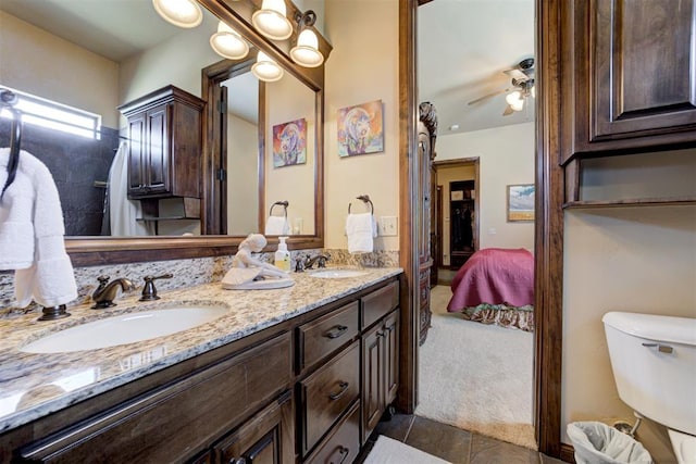 2293 Cottage Ln, Blanchard, OK 73010 - ensuite bathroom with double vanity, tile patterned flooring, and a ceiling fan