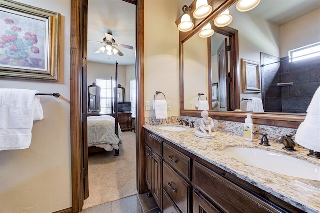 2293 Cottage Ln, Blanchard, OK 73010 - full bathroom featuring double vanity, ensuite bath, a ceiling fan, and a tile shower