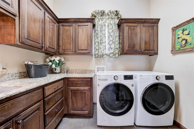 2293 Cottage Ln, Blanchard, OK 73010 - washroom featuring cabinet space, independent washer and dryer, and tile patterned floors