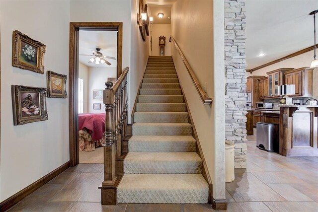 2293 Cottage Ln, Blanchard, OK 73010 - stairs with a ceiling fan, stone tile flooring, and crown molding