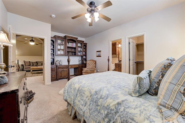 2293 Cottage Ln, Blanchard, OK 73010 - bedroom featuring light colored carpet, ceiling fan, and built in study area
