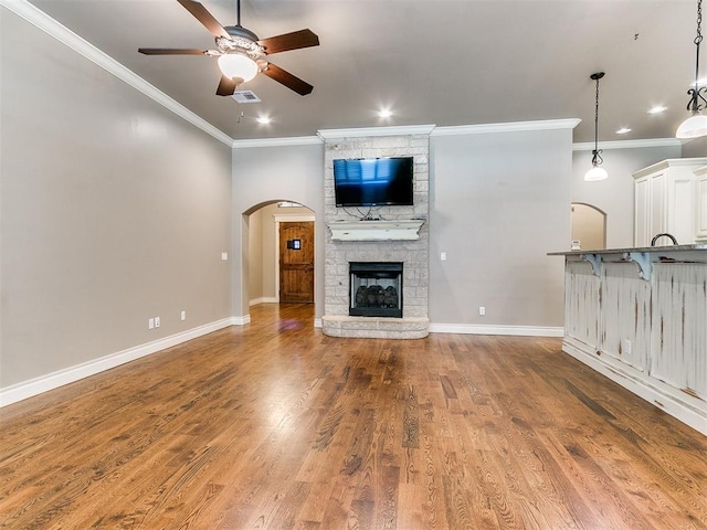 13340 Greenscape Rd, Piedmont, OK 73078 - unfurnished living room featuring crown molding, a ceiling fan, and wood finished floors