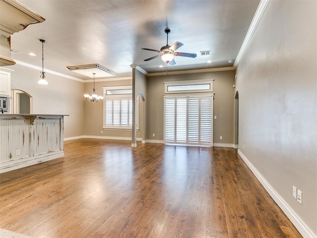 13340 Greenscape Rd, Piedmont, OK 73078 - unfurnished living room featuring visible vents, dark wood-style floors, arched walkways, and ceiling fan with notable chandelier
