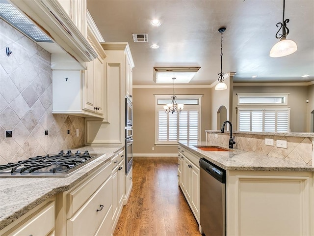 13340 Greenscape Rd, Piedmont, OK 73078 - kitchen featuring a sink, tasteful backsplash, light wood finished floors, and stainless steel appliances