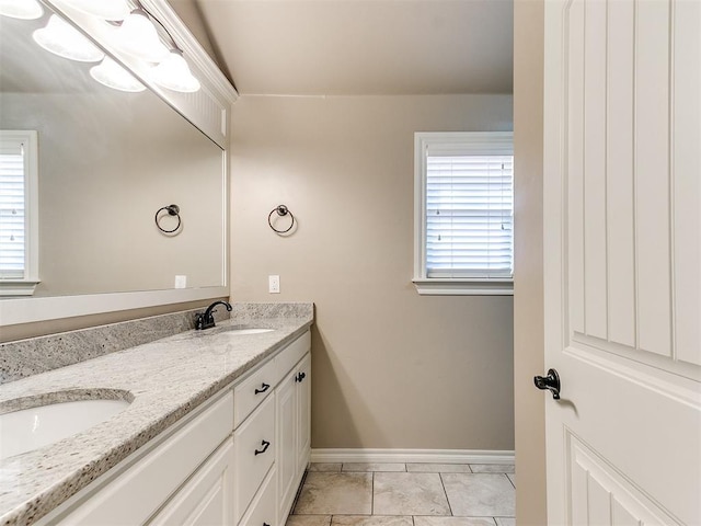 13340 Greenscape Rd, Piedmont, OK 73078 - bathroom featuring double vanity, baseboards, and a sink