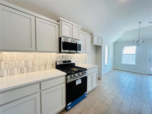 1104 SW 139th St, Oklahoma City, OK 73170 - kitchen with stainless steel appliances, tasteful backsplash, vaulted ceiling, a chandelier, and light countertops