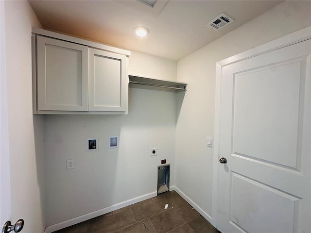 1104 SW 139th St, Oklahoma City, OK 73170 - washroom with electric dryer hookup, baseboards, cabinet space, washer hookup, and dark tile patterned floors