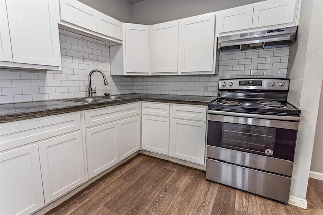 kitchen with dark wood-style flooring, white cabinetry, electric range, under cabinet range hood, and a sink