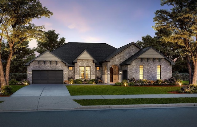 10000 Calypso Way, Yukon, OK 73099 - french provincial home with a front yard, an attached garage, concrete driveway, and brick siding