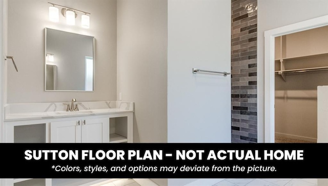 10000 Calypso Way, Yukon, OK 73099 - bathroom with a walk in closet and vanity