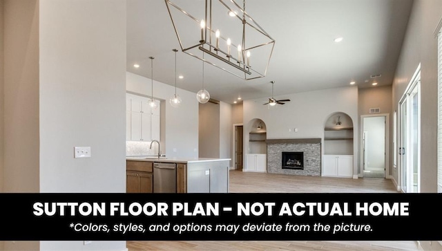10000 Calypso Way, Yukon, OK 73099 - kitchen featuring stainless steel dishwasher, ceiling fan, built in features, a fireplace, and light wood-style floors