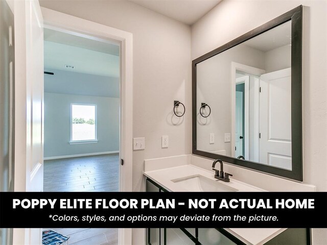 1116 SW 139th St, Oklahoma City, OK 73170 - bathroom featuring vanity, wood finished floors, and baseboards