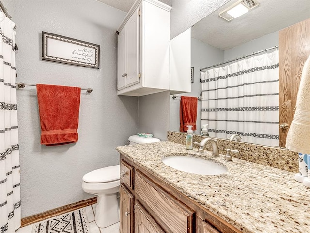 933 Luglena Ln, Purcell, OK 73080 - full bathroom featuring toilet, vanity, a textured wall, and a textured ceiling