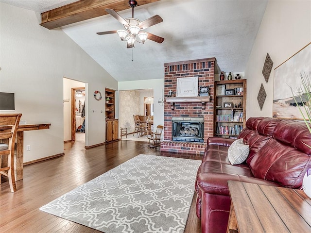 933 Luglena Ln, Purcell, OK 73080 - living area featuring a fireplace, ceiling fan, wood finished floors, and baseboards
