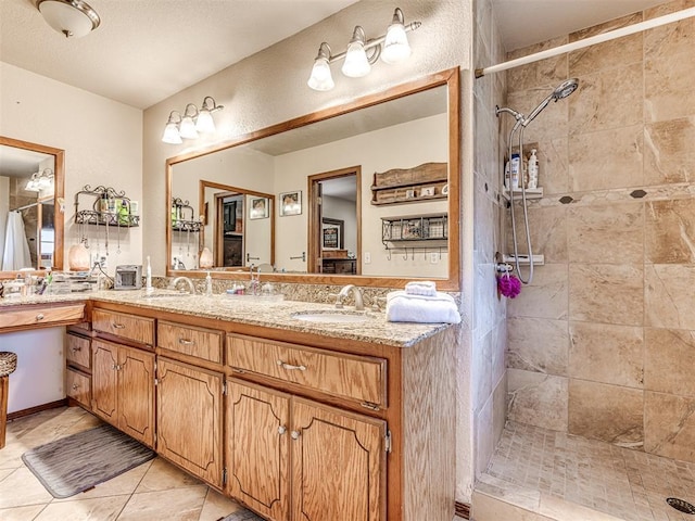 933 Luglena Ln, Purcell, OK 73080 - full bathroom featuring a tile shower, double vanity, and tile patterned flooring