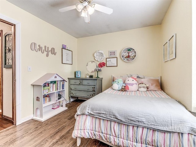 933 Luglena Ln, Purcell, OK 73080 - bedroom with wood finished floors, ceiling fan, and baseboards