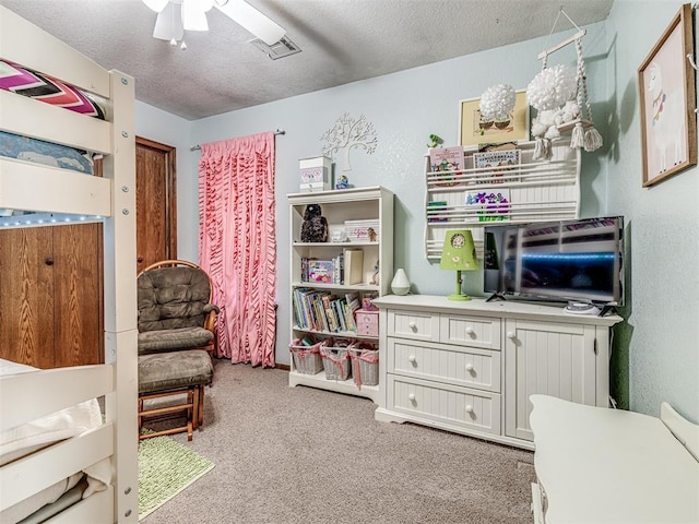 933 Luglena Ln, Purcell, OK 73080 - bedroom with carpet floors, a textured ceiling, and a ceiling fan