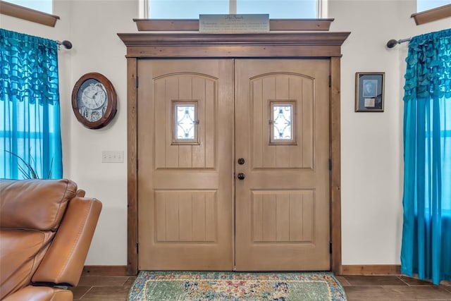 foyer entrance with baseboards