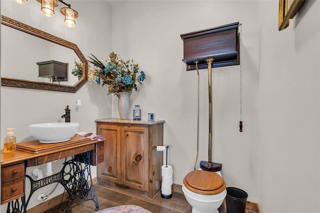 bathroom with vanity and baseboards