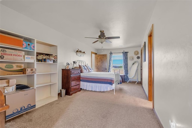 carpeted bedroom featuring a ceiling fan
