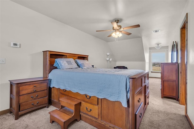 bedroom featuring light colored carpet, baseboards, a ceiling fan, and visible vents