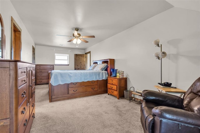 bedroom featuring light colored carpet and ceiling fan