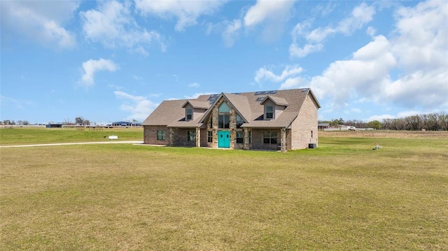 craftsman-style home featuring a front lawn