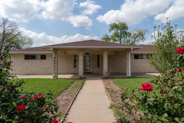 515 W Tennessee Ave, Pauls Valley, OK 73075 - single story home with a front lawn and brick siding